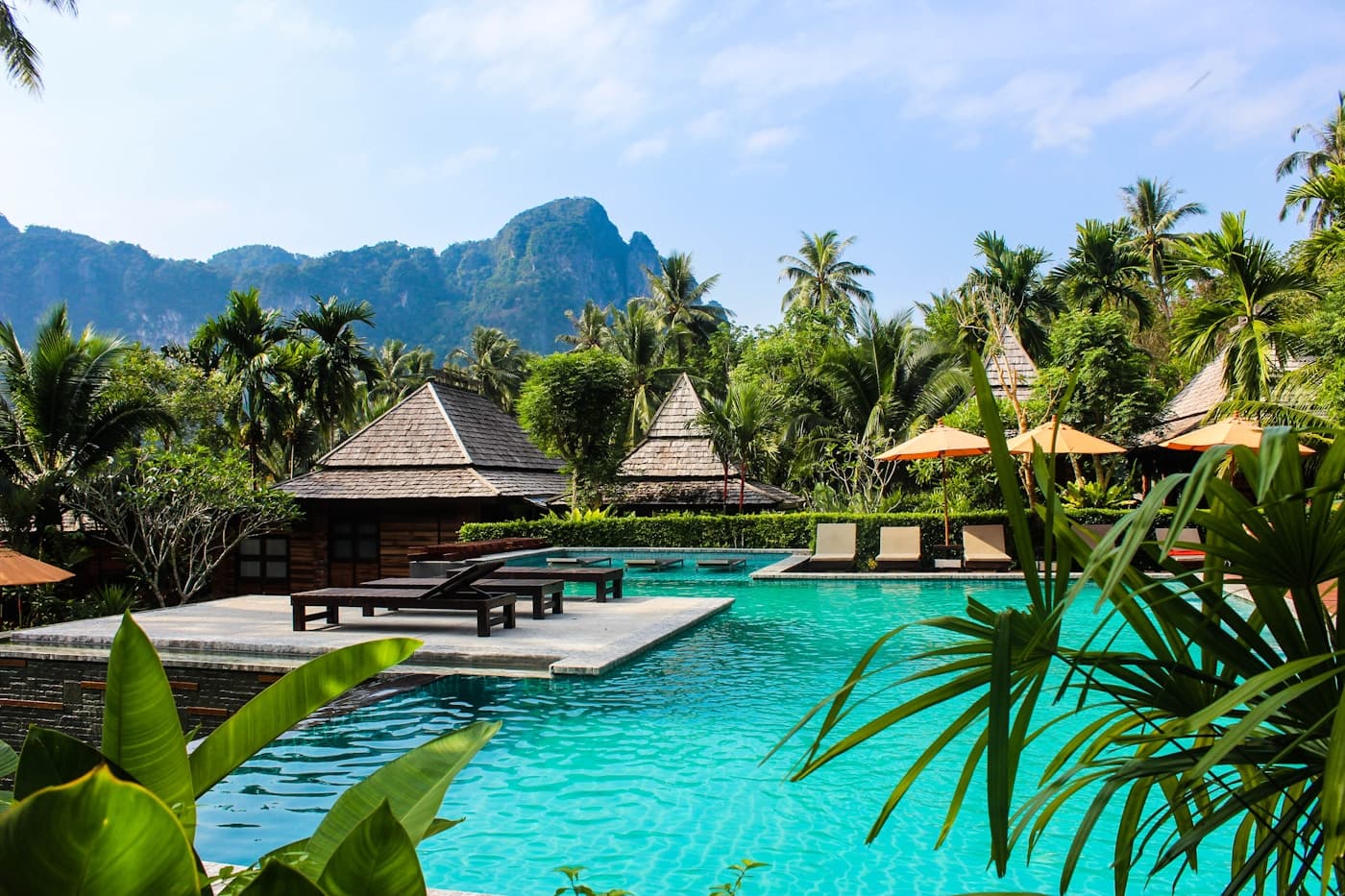 Tropical mountain retreat framed by palms and high ridges